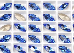 sapphire crystal navette in settings 5x10 mm