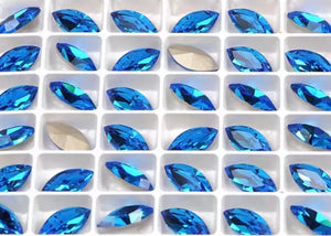 capri blue crystal navette in settings 5x10 mm