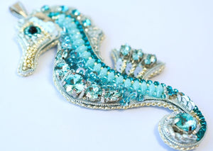 bead embroidered blue seahorse necklace