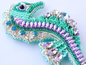 bead embroidered teal lilac seahorse jewelry