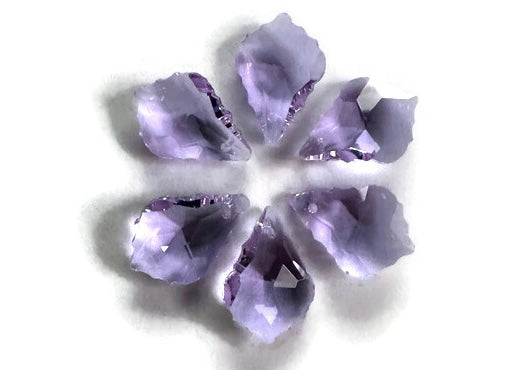 A pendant designed in the shape of a maple leaf, made with purple crystals.