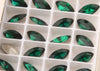 emerald crystal navette in settings 4x8  mm