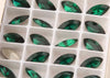 emerald crystal navette in settings 5x10 mm