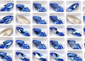 sapphire crystal navette in settings 4x8  mm